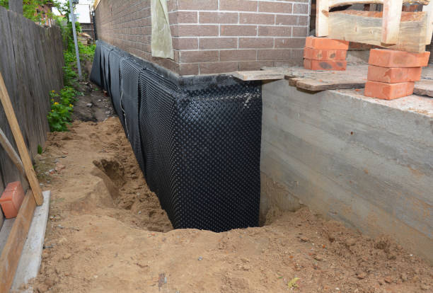 SJ Waterproofing Pros technician performing targeted Waterproofing assessment in Howard City, MI